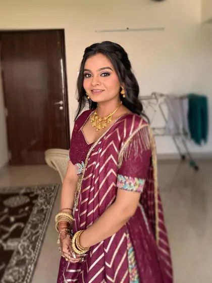 This bride is all smiles for her engagement. Her makeup is clean and radiant, with a focus on enhancing her natural features to create a fresh and youthful glow.