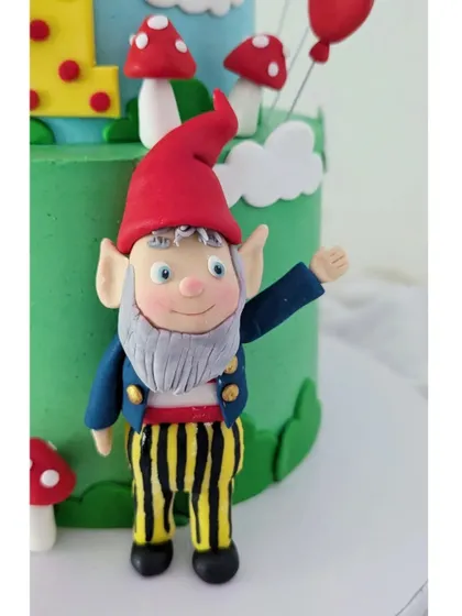 The Big Ears figurine, with his striped trousers and friendly wave, ready to welcome guests to Toyland.