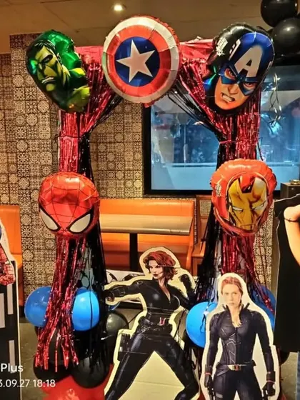 A fun photo opportunity at the Avengers party, with cutouts of Spiderman and Black Widow. The birthday boy is clearly a fan.