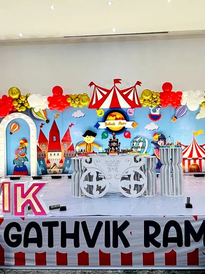 The main stage for the red, white, and gold carnival theme, featuring a castle and circus tent backdrop.