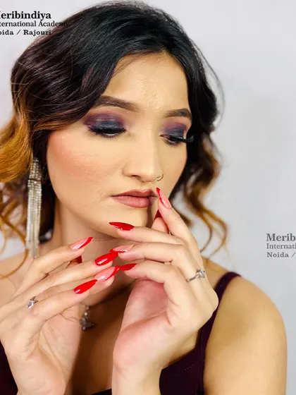 A dramatic smokey eye look paired with soft, wavy hair, perfect for a cocktail party or evening event.