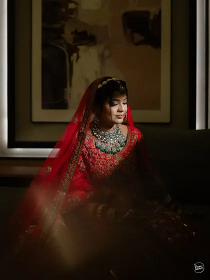An artistic portrait of the bride, using shadows and light to create a moody and beautiful image.