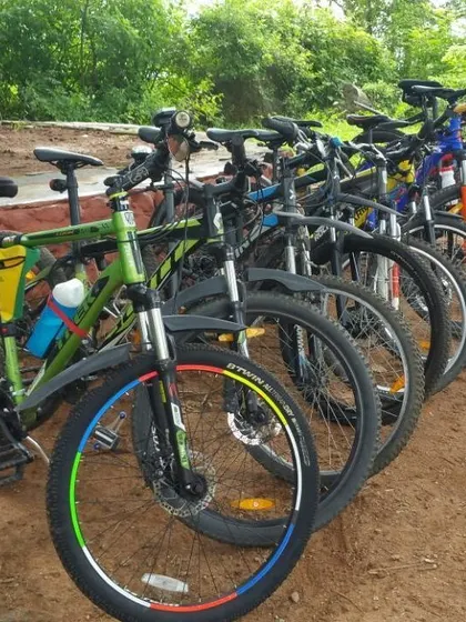 A close-up of the different mountain bikes in our group, showing a variety of colors and setups.