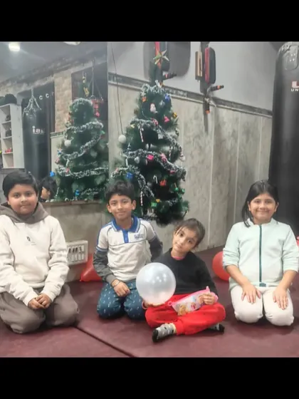 Some of our youngest students enjoying the Christmas party. It's important for them to see the dojo as a place of fun and friendship.