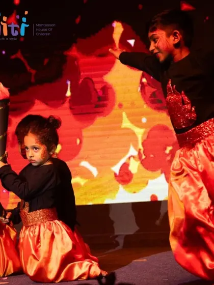 Two performers as Agni, their expressions serious and focused, perfectly capturing the intensity of fire.