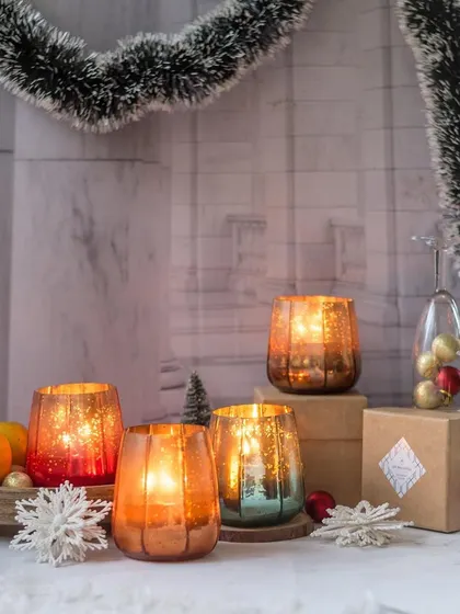 Our festive mercury glass candles are here to fill your home with love and light. The mottled finish creates a magical, sparkling effect, making them the perfect accessory for your holiday decor.