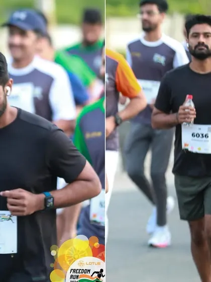 A runner stays hydrated while maintaining his pace during the challenging Freedom Run course.