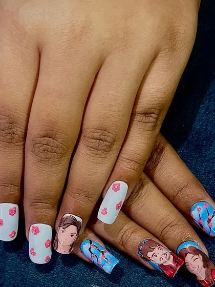 Another shot of the custom Ghibli-style portrait nails, displaying both hands to show the complete, cohesive design.