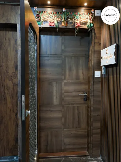 The view from inside, showing the solid wooden door that complements the safety door's design.