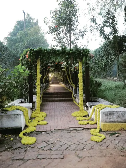 This image captures the full length of the decorated bridge, which serves as a beautiful and unique walkway for guests arriving at the event.
