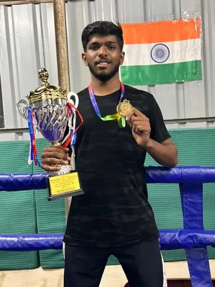 My student celebrating his gold medal and trophy at the Bengaluru University Inter-college Boxing Championship.