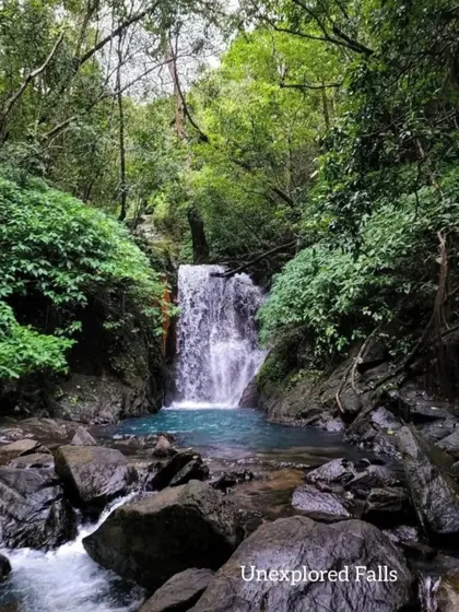 An unexplored waterfall with a brilliant blue pool, one of the many secrets we uncover on our offbeat trips in Uttara Kannada.