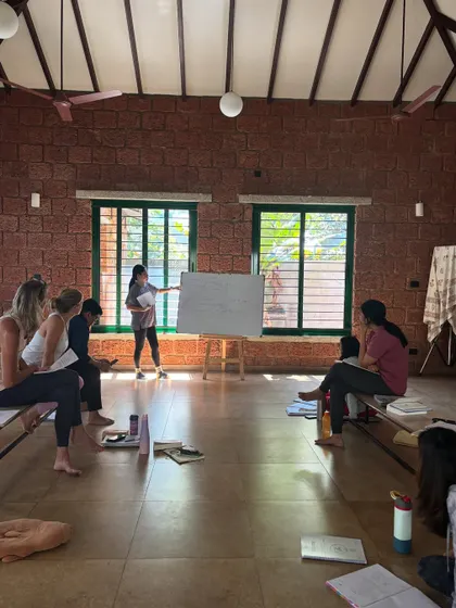A student presents her understanding of a yogic principle. This is a key part of our teaching methodology, empowering students to build confidence and find their own teaching style.