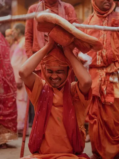 A comprehensive photo series from Lathmaar Holi in Barsana. These images document the unique tradition where women playfully hit men with sticks, recreating a legend of Lord Krishna and Radha. The photos are filled with motion, color, and raw emotion.