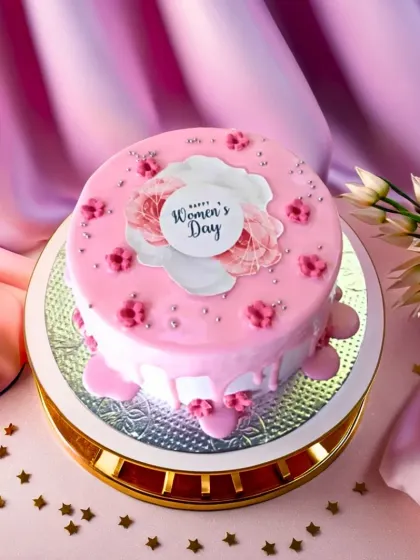 Our Flowers Bloom Cake for Women's Day, a pretty pink drip cake to celebrate the women who make life sweeter.