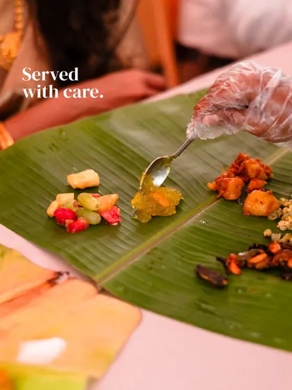 Served with care. Each element of the Yele Oota is placed with intention on the banana leaf, a ritual we honor to preserve the authenticity of this traditional South Indian wedding feast.
