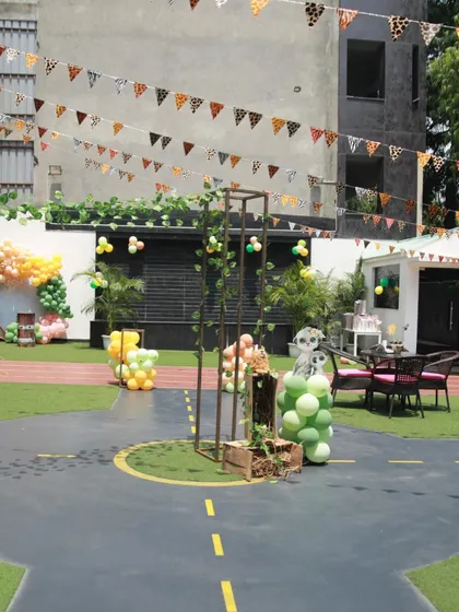 The outdoor area transformed for a Madagascar jungle theme, with animal-print bunting and decorations showing the versatility of the space.