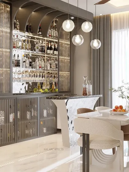 This view highlights the stylish bar unit with fluted glass, which sits next to the modern dining table. It's a great example of how we integrate different functional zones, like dining and entertaining, into one seamless and elegant space.