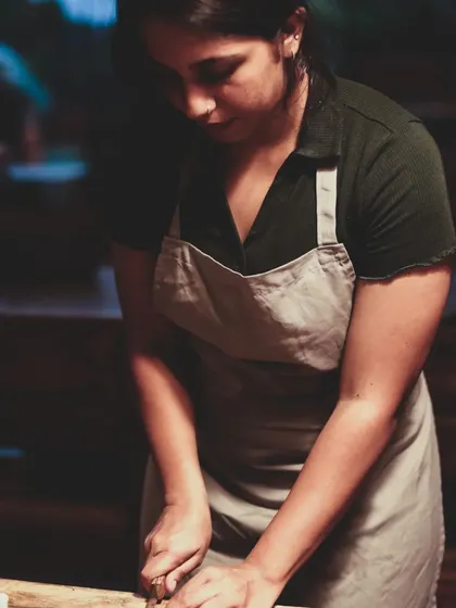 Focus and precision. A student learns the art of chopping, a fundamental skill for any cuisine, during our weekend masterclass.