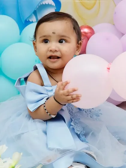 A happy birthday girl enjoying her princess-themed party. We focus on creating joyful moments like these with our beautiful decorations.