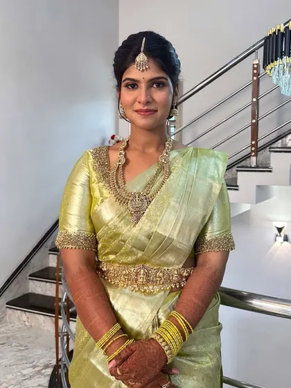 A simple and elegant engagement look. The makeup is minimal yet polished, with a focus on clean skin and defined features that enhance her natural beauty for this special occasion.