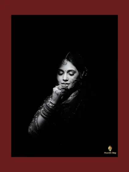 A bridal portrait is a story told in light and shadow. Here, I wanted to capture the bride's contemplative grace and the intricate details of her traditional look in a classic, monochrome frame.