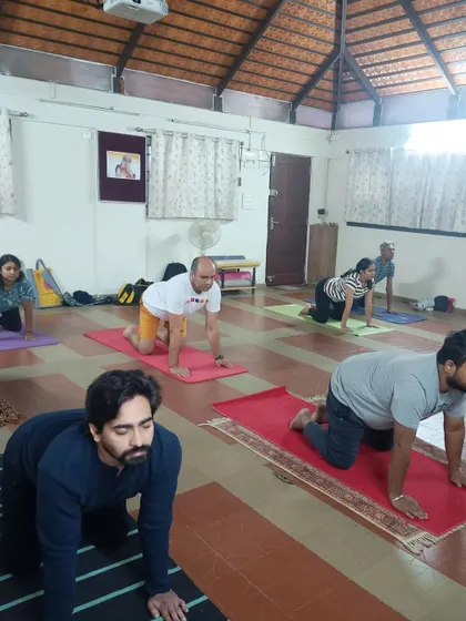 A typical morning class in our Bangalore studio. Participants are seen here in a preparatory posture for Surya Kriya. My focus is always on providing individual corrections and ensuring everyone is aligned correctly to get the most out of their practice.