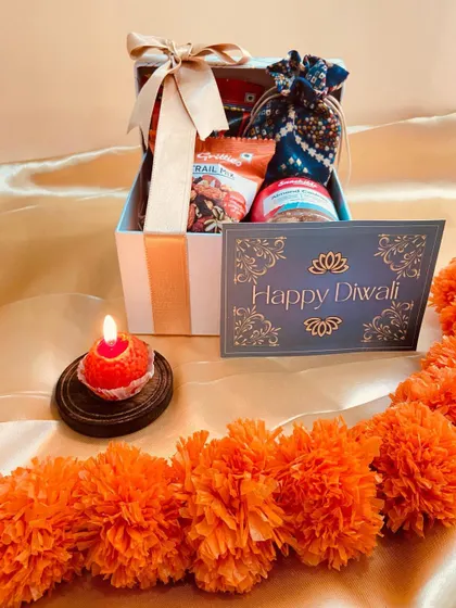A simple and sweet Diwali box hamper, containing trail mix and cookies, perfect for casual gifting.