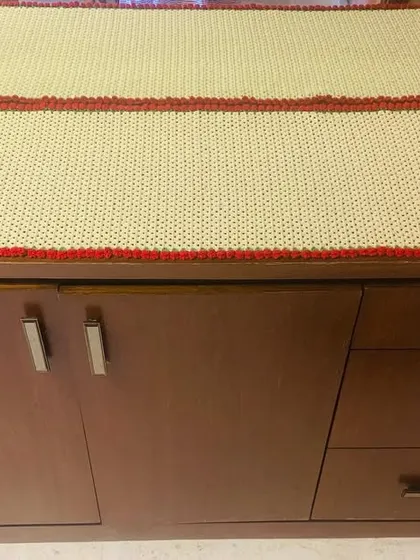 Another view of the custom side table runner, showing how it perfectly covers the surface of the cabinet.
