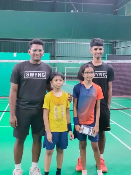 Our tournament winner and runner-up posing with their coaches. We celebrate every player's journey and achievements.