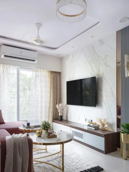 The TV wall design from 'The Adobe' project, where I aimed for a calm and cozy vibe that is both timeless and functional. The combination of marble, wood, and clean lines achieves this balance perfectly.