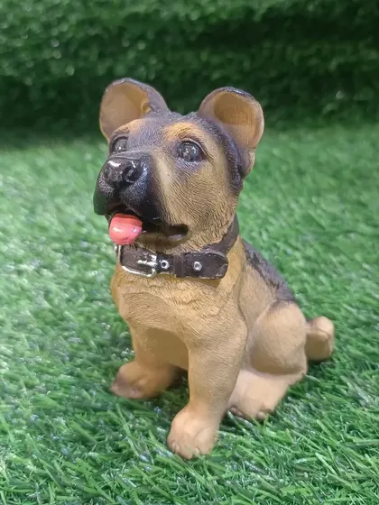 A cute German Shepherd puppy figurine, a perfect little gift for any dog lover.