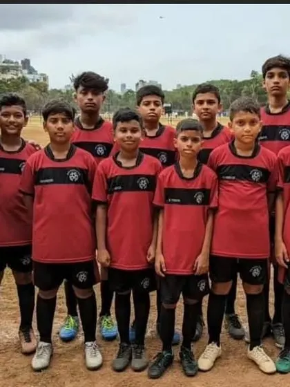 Our Under-13 team stands united with their coach before a match in the MFA Yuva Premier League. This photo represents the discipline, focus, and team spirit we cultivate in our competitive squads.