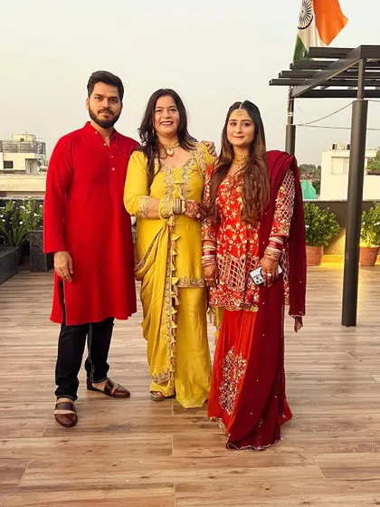 Coordinating a whole family's look for an event is my specialty. For this occasion, I designed a mustard sharara with dabka hand embroidery, a burnt orange and maroon garara peplum outfit, and a complementary red kurta for a cohesive and stunning family ensemble.