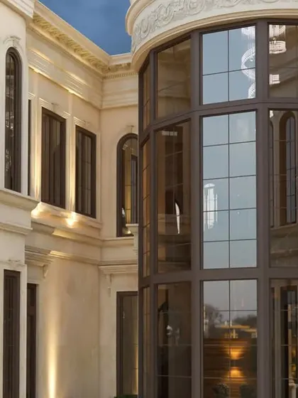 A detailed view of the curved glass facade and window articulation, demonstrating precision in execution and material selection.