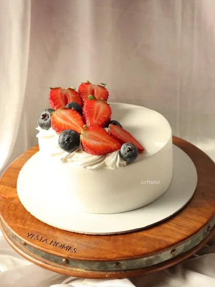 A simple, elegant, and delicious cake topped with fresh berries.
