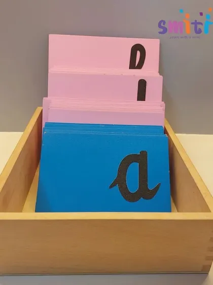 A box of our cursive sandpaper letters, ready for children to explore. These scientifically designed materials are key to our successful language program.