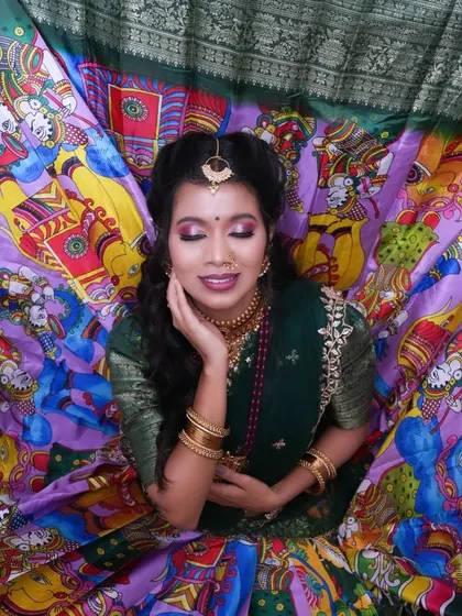 The vibrant Kalamkari print skirt spread out creates a beautiful backdrop for this top-down shot.