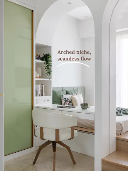 The arched niche in this teen's room serves as a divider and houses a compact work desk, a standout solution for zoning the space while maintaining a seamless flow.
