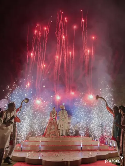 I believe every union deserves a grand beginning. This shot captures the pinnacle of celebration, where I coordinate spectacular fireworks and dramatic lighting to create a breathtaking, unforgettable moment for the couple and their guests.