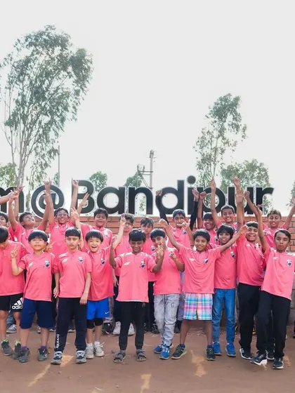 That's a wrap on our Ooty tour! The team celebrates at the "I Love Bandipur" sign after an exciting safari where they spotted tigers, elephants, and more.