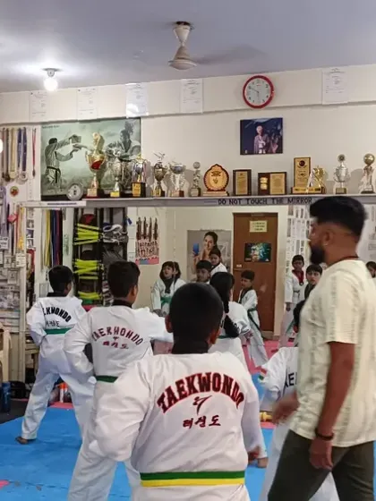 I lead the class from the front, demonstrating the next move in the sequence.