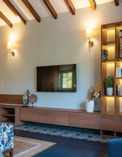 The bedroom in Chikoo Villa features custom furniture in oak and Afromosia veneer, with rattan details adding a warm, inviting ambiance. The minimalist design keeps the space feeling open and airy.