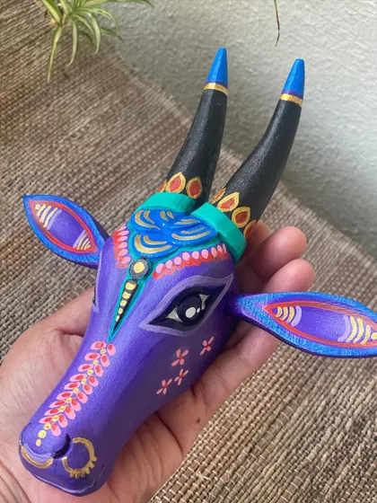 A duplicate image of the charming purple Nandi with pink floral details.