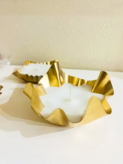 Another one of our new urli designs for the festive season, featuring a fluted gold-tone metal bowl.