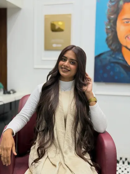A smiling shot of our client with her new chocolate brown hair. The color perfectly complements her skin tone.