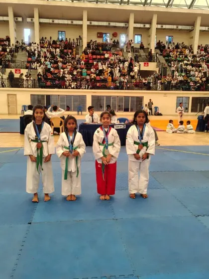 Our talented female students proudly displaying their medals after a successful competition. They are strong, skilled, and ready for any challenge.