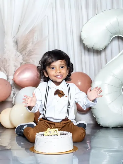 All smiles for his second birthday! This little boy is ready to celebrate.