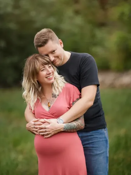 A warm embrace from behind, showing the support and love of a partner. These couple poses add another layer of emotion to your maternity gallery.