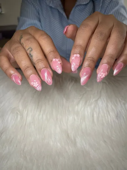 A dreamy pink cat eye set with delicate, scattered 3D floral details.